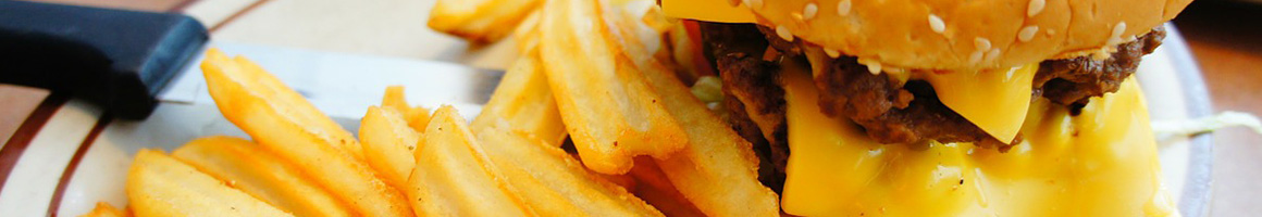 Eating Burger at Log Cabin Cafe restaurant in Choteau, MT.